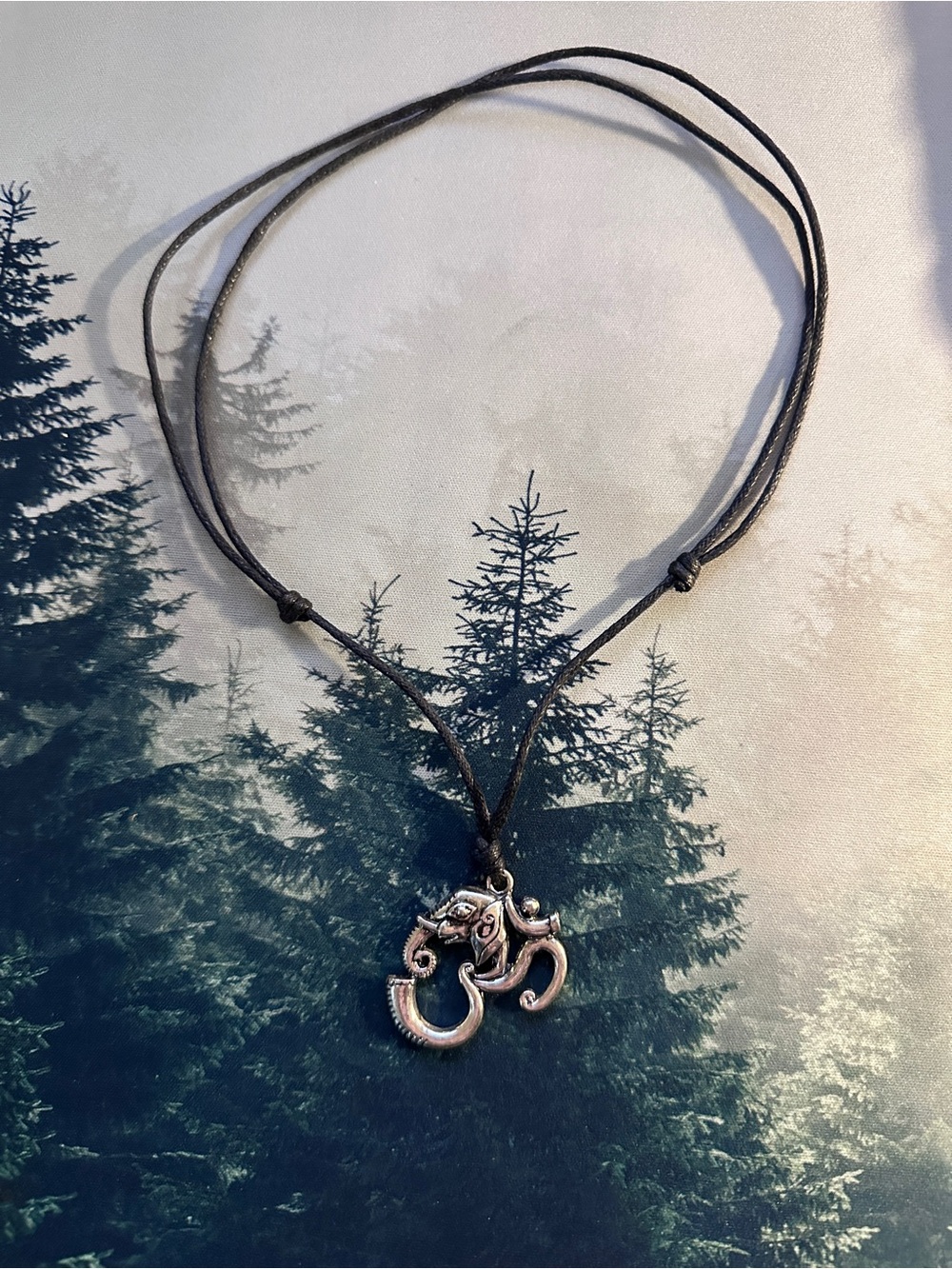 Silver Om pendant with elephant design on black cord #spiritual #boho #necklace